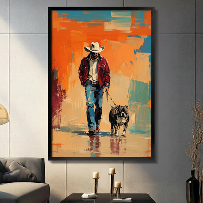 Framed wall art print of a cowboy walking a bulldog on an abstract orange and teal painted background, displayed above a console table in a modern living room