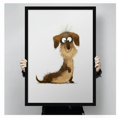 Close-up of black framed cute dachshund cartoon wall art print held by hands, showing detailed fluffy long dog illustration with expressive big eyes