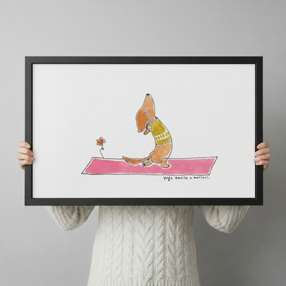 Person holding large framed cute hand-drawn watercolor illustration brown dachshund dog wearing olive green vest doing cobra yoga pose with long body stretched forward on bright pink yoga mat beside a small orange flower on white background canvas print with both hands against light grey background - close up size reference of funny dachshund yoga pink mat wall art with black frame finish
