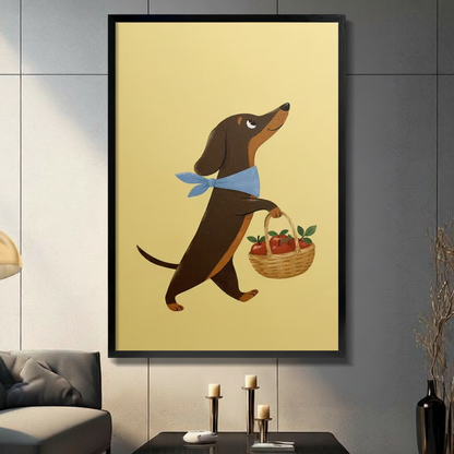 Framed dachshund wall art print featuring a brown dachshund with blue bandana carrying an apple basket, displayed in a modern living room with dark gray sofa and black candlestick holders