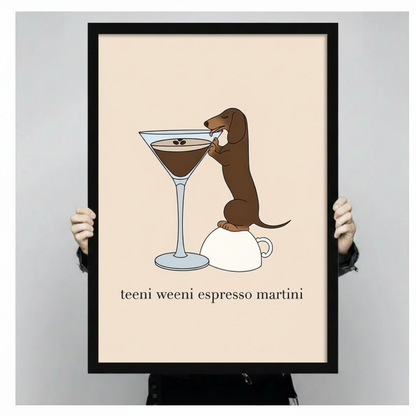 Dachshund espresso martini print in black frame held in hands, showing print size and quality