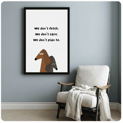 Funny dachshund framed art print beside armchair – grumpy sausage dog quote wall decor – minimalist pet lover gift idea for reading nook or hallway