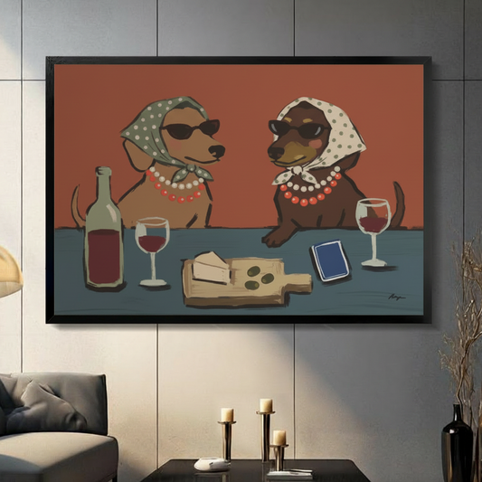 Framed canvas art print of two dachshunds wearing polka dot headscarves and pearl necklaces sharing red wine and cheese — humorous animal wall art for living room