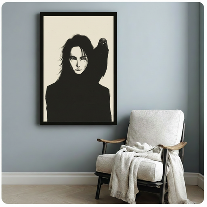 Dark gothic ink illustration of a mysterious long-haired figure in black with a raven perched on one shoulder on an ivory background gothic wall art framed print beside white armchair on blue-gray wall