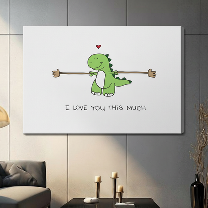 Gallery wrap stretched canvas of a smiling green cartoon dinosaur spreading arms wide with I Love You This Much quote hung frameless on a dark gray paneled wall above candlestick holders