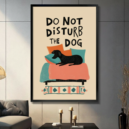 Do Not Disturb The Dog framed wall art print displayed in a modern living room above a console table with candles