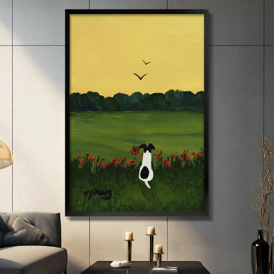Framed wall art print of black and white dog sitting in red poppy field with yellow sky in modern living room