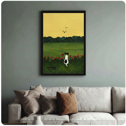 Black framed dog and poppy field art poster on sage green wall above neutral linen sofa in cozy living room