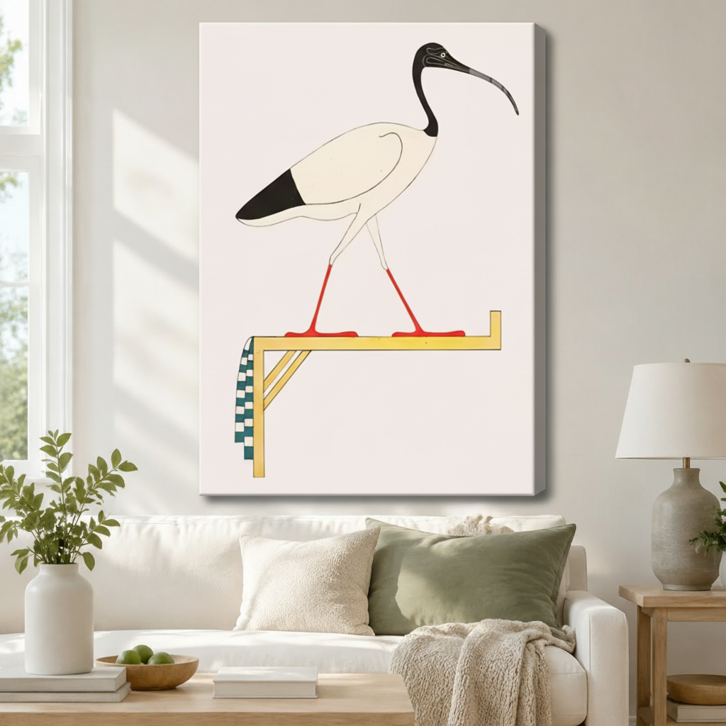 Gallery-wrapped canvas of an ancient Egyptian sacred ibis bird on a gold and checkered perch with cream background hung above a white sofa in a cozy neutral living room