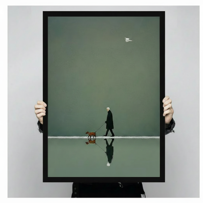 Hands holding framed elderly person in black coat and brown dog walking on still water with mirrored reflection minimalist illustration canvas – olive green tonal background white bird canvas wall art size reference display