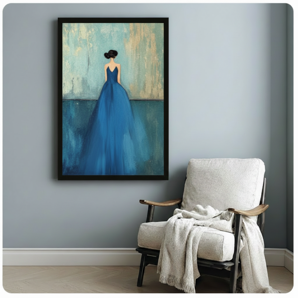 Black framed modern minimalist oil painting graceful woman with black updo seen from behind in flowing sapphire blue ball gown on distressed teal and gold textured background canvas print beside white wood accent chair on pale blue-grey wall - dreamy woman in blue dress back view wall art for reading nook decor