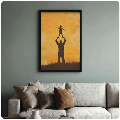 Black framed wall art print of father raising child silhouette, styled above a linen sofa against a sage green wall