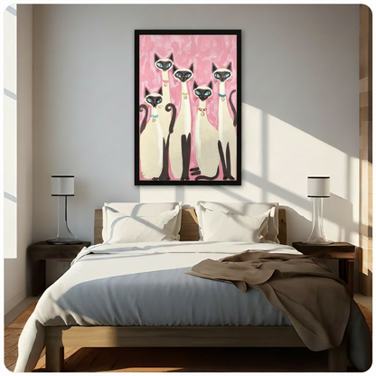 Retro folk art painting of five Siamese cats with blue eyes and colorful collars grouped together on a pink brushstroke background cat wall art framed print above bedroom with white bedding and dark wood bedside tables