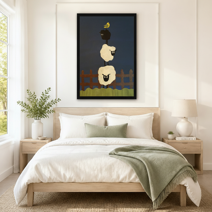 Black framed whimsical folk art stacked sheep and yellow bird canvas art with two round cream woolly sheep balanced on top of each other and a small black sheep on top with a bright yellow bird perched on its back above a rustic brown wooden fence and a wavy green grass strip on a deep navy blue background, hung above a light wood bed frame in a serene Scandinavian bedroom with crisp white linen bedding, a sage green throw blanket, white nightstands, a white ceramic table lamp, and a white vase of greenery