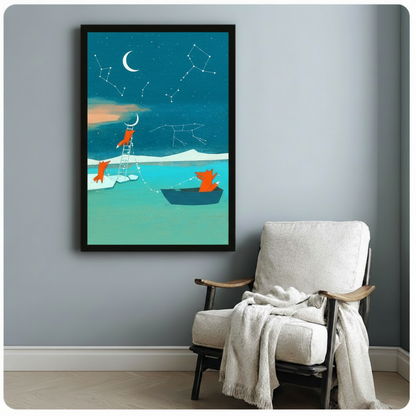 Black-framed whimsical fox wall art showing three orange foxes exploring a teal moonlit landscape with constellation star maps and a crescent moon, styled on a soft grey wall beside a white linen armchair