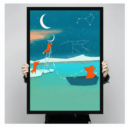 Close-up of fox constellation and crescent moon framed art print held by hands, showing vibrant teal and orange colors