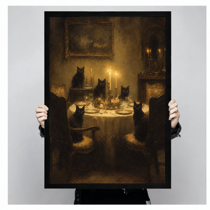  Framed black cat dinner canvas wall art held by hands, featuring cats around a table set with plates and wine glasses