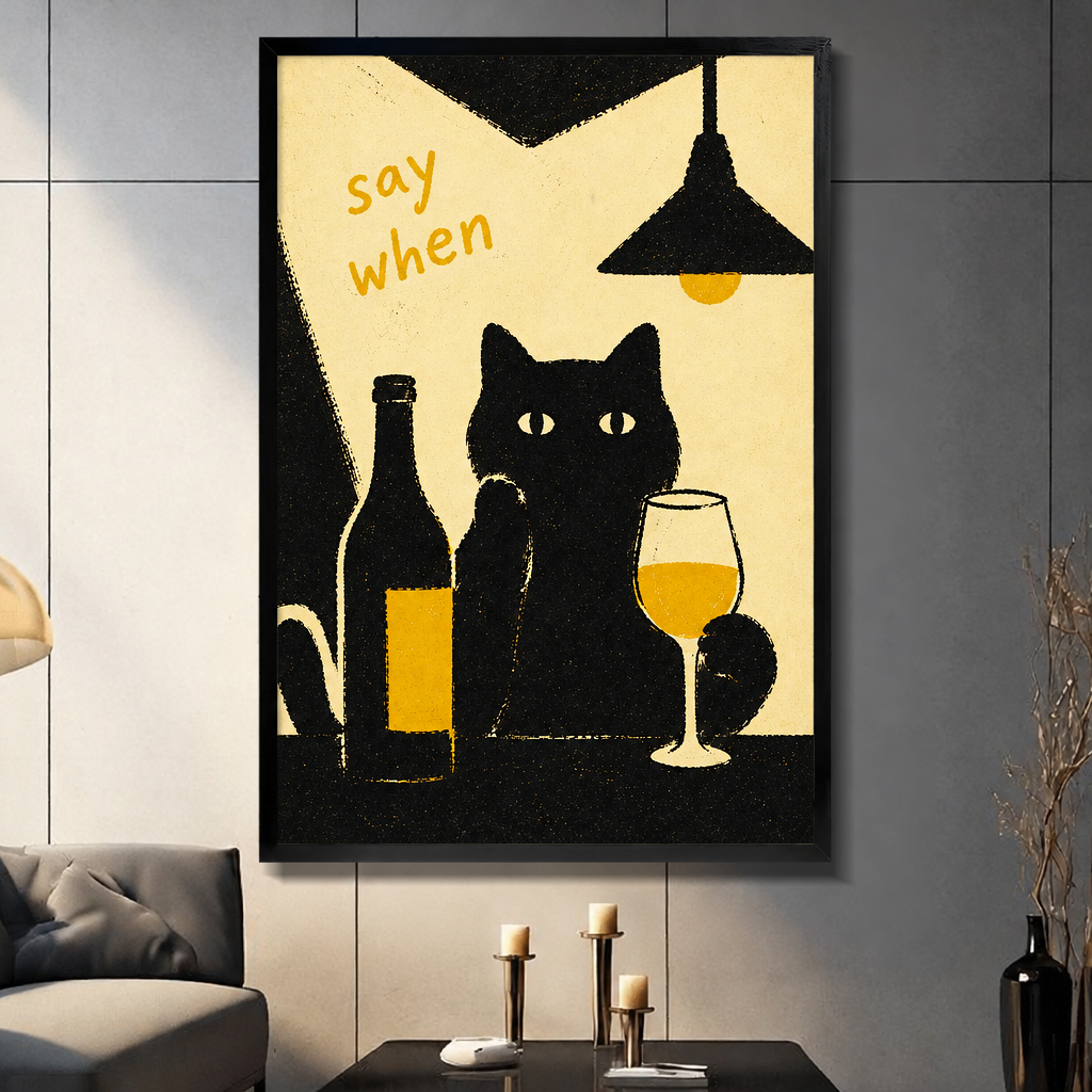  Framed black cat wine canvas wall art in a living room, showing a cat holding a wine glass beneath the words “say when”