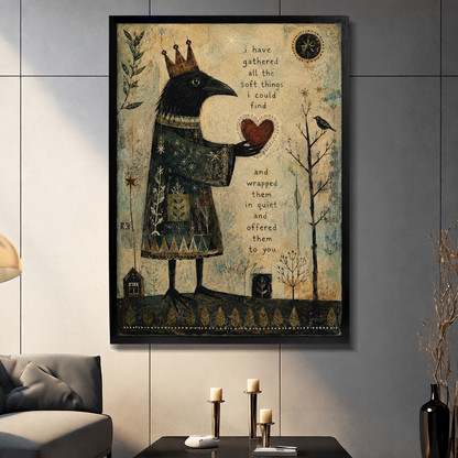Framed crow heart canvas wall art displayed in a living room, featuring a crowned raven holding a heart beside an inspirational quote

