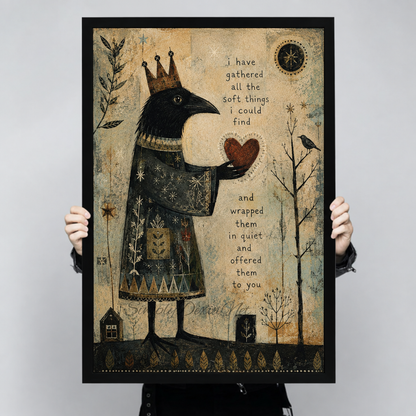 Framed crowned crow heart canvas wall art held by hands, featuring a raven offering a red heart