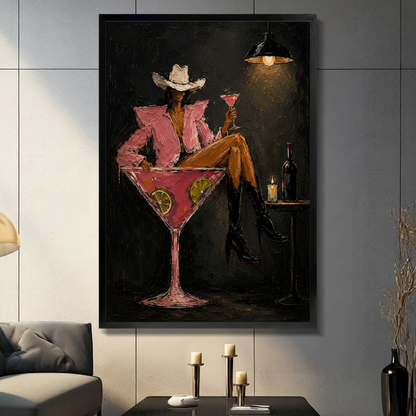 Cowgirl in pink blazer and white cowboy hat sitting in giant martini glass, moody bar impasto canvas wall art in black float frame, hung on dark gray tile wall above console table with candle holders in modern American living room