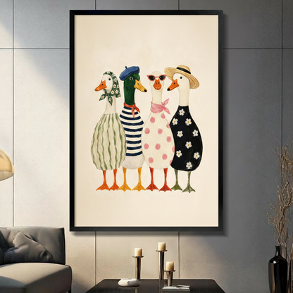 Four fashionable anthropomorphic ducks in French style outfits including striped dress, navy sailor top, pink polka dot dress, and black daisy dress with beret, straw hat, floral headscarf, and red sunglasses cute illustration framed wall art print displayed in a living room with dark gray sofa, pillar candle holders, and black decorative vase