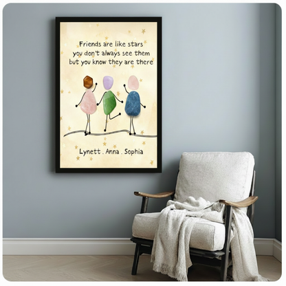 Black framed colorful pebble stone friends holding hands personalized quote canvas friendship gift wall art beside lounge chair