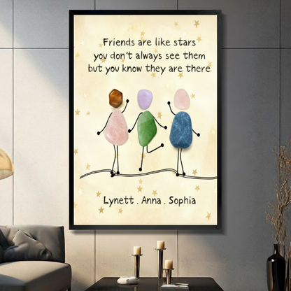 Black framed personalized friendship quote canvas with colorful pebble stone figures holding hands friends are like stars wall art in living room
