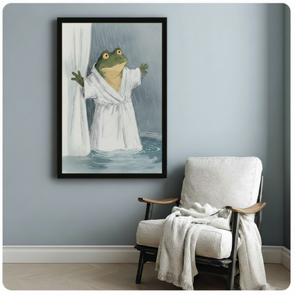 Black framed frog bathrobe wall art hung on blue-gray wall beside armchair, quirky animal print for home decor