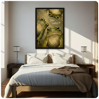 Black framed charming humor oil painting of three green bullfrogs with expressive golden eyes crowding the canvas including a top-hanging frog and a large front-facing frog with You Good hand-lettered text whimsical frog canvas wall art on olive gold impasto background hung above a dark wood bed with white linen bedding