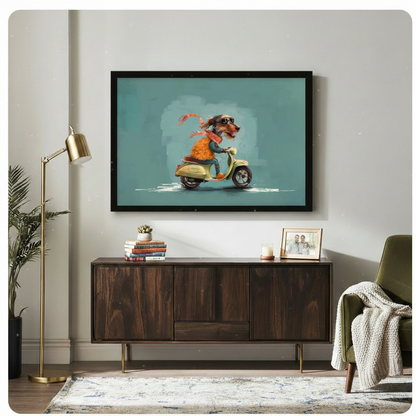 Black framed cartoon dachshund riding retro scooter wall art in teal blue above a dark walnut sideboard with stacked books and a succulent, beside a brass floor lamp and olive green armchair with a knit throw blanket in a modern living room