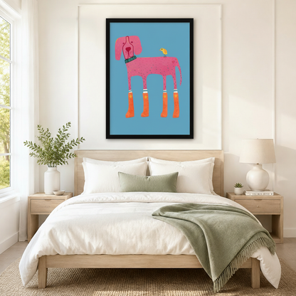 Black framed funky pink dog in orange star rain boots with yellow bird canvas art in sky blue above a bed with white linen bedding, a sage green throw blanket, light wood nightstands, a succulent, and a ceramic table lamp in a modern bedroom