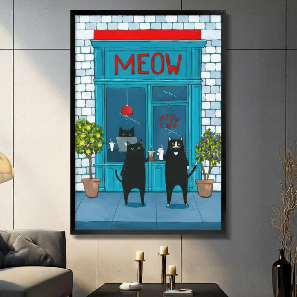 Framed funny illustration canvas wall art of two black cats standing upright outside a teal blue Meow Cafe storefront holding coffee cups with red signage and potted green plants on a dark grey wall in a modern living room with candle holders