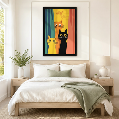 Black framed funny cats Whatcha Doing canvas art with three curious wide-eyed cartoon cats — orange, yellow, and black — peeking through colorful teal yellow and coral retro curtains, hung above a light wood bed with white linen bedding and a sage green throw in a serene Scandinavian bedroom