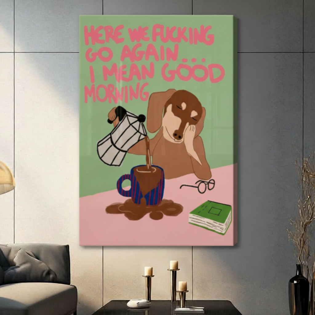 Stretched canvas wall art of a humorous half-asleep brown dachshund pouring overflowing coffee into a striped blue mug with a sarcastic good morning quote in pink hand-lettering on a color-blocked green and pink background, hung on a dark gray tile wall beside a modern gray sofa with candlestick decor