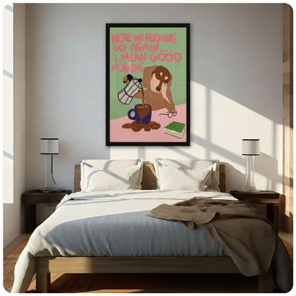 Black framed humorous sleepy dachshund coffee morning canvas art with a tired brown wiener dog pouring overflowing coffee and a witty pink good morning quote on a green and pink background, hung above a wooden bed frame in a sun-drenched minimalist bedroom with crisp white linen bedding and matching cylindrical nightstand lamps