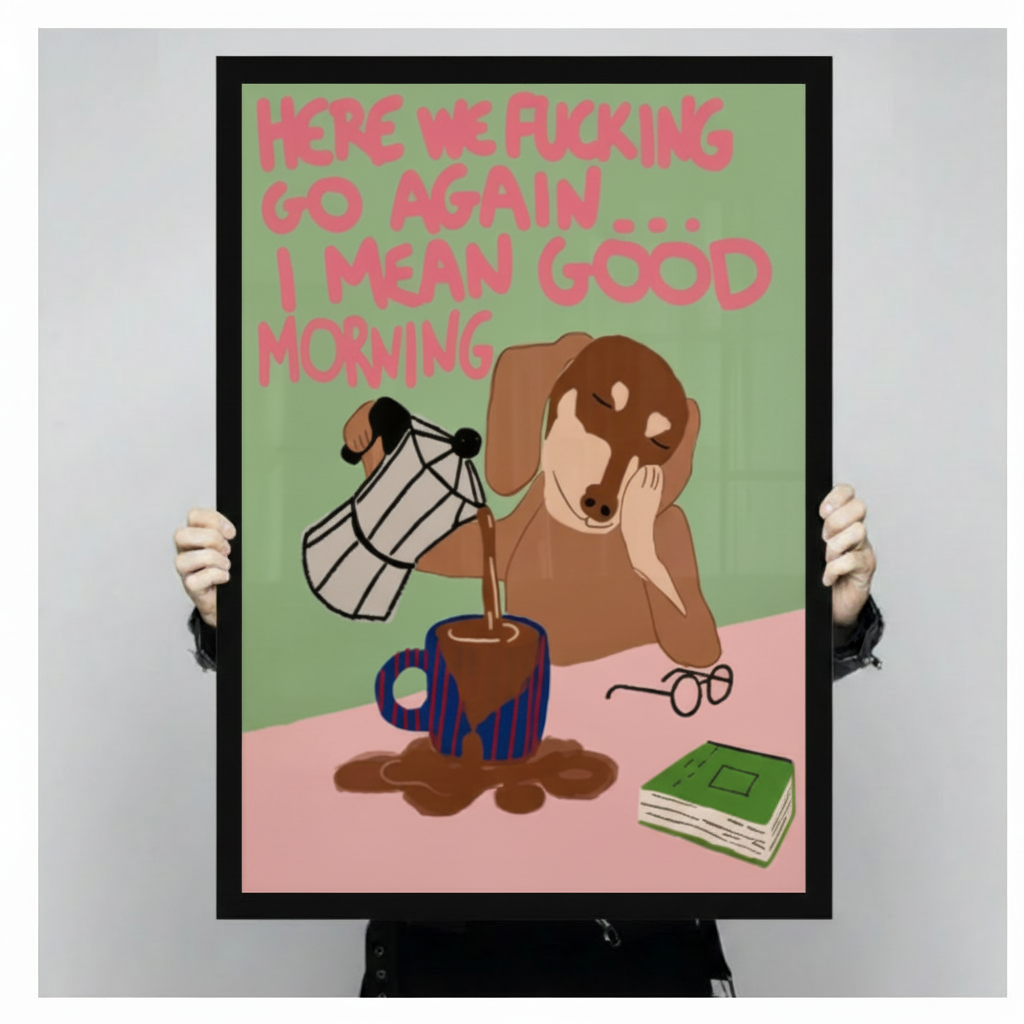Person holding a large vertical black framed funny dachshund pouring coffee canvas art print showing a drowsy brown wiener dog spilling coffee from a moka pot with a sarcastic here we go again I mean good morning quote in pink text on a green and pink background against a light gray studio backdrop