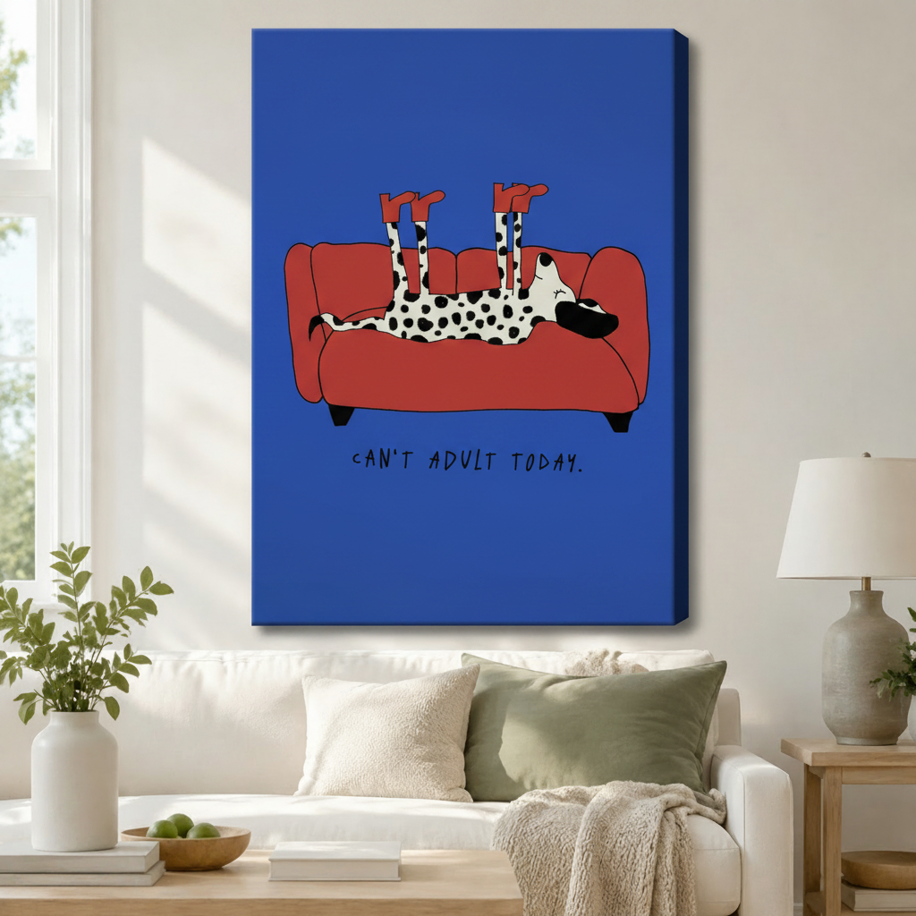 Funny Dalmatian "Can't Adult Today" gallery wrap canvas art in cobalt blue displayed above a white sofa in a bright Scandinavian living room