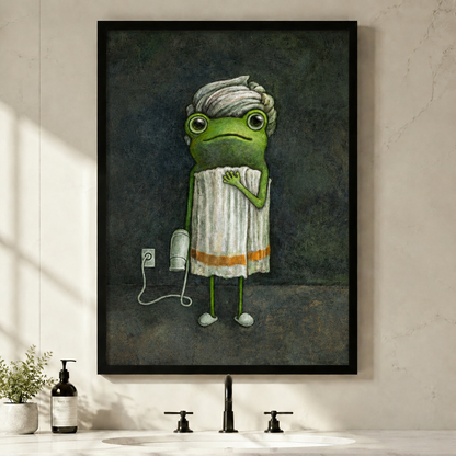 Framed funny frog with towel and hair dryer wall art hanging above a black faucet in a minimal modern bathroom