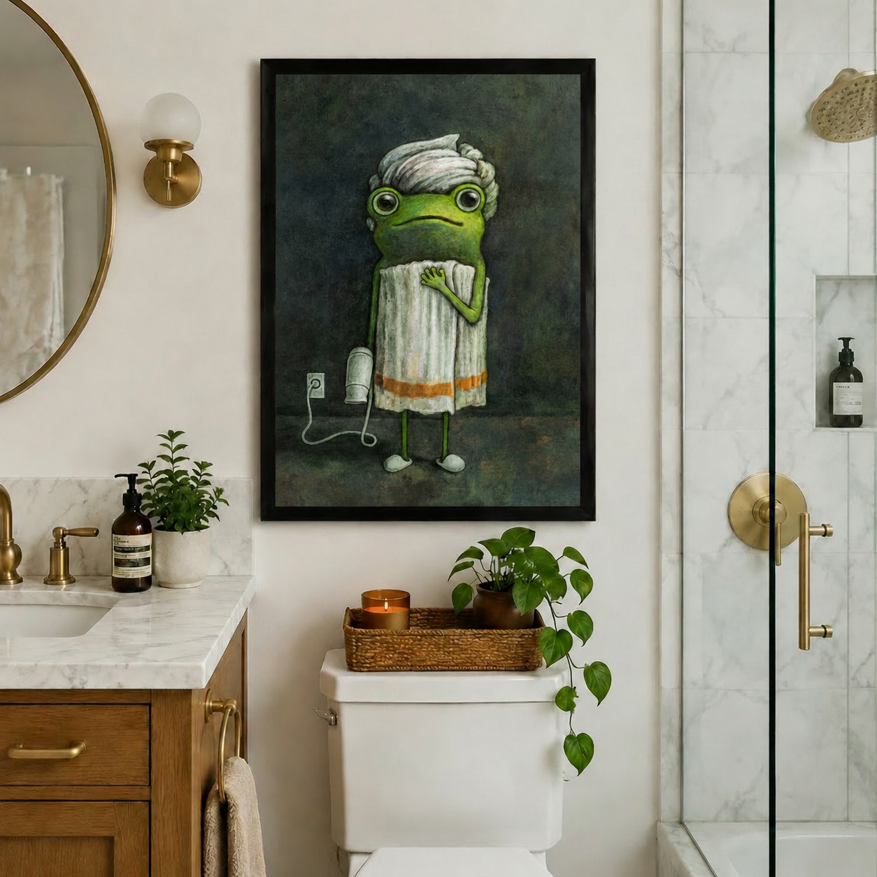 Framed frog bathroom art print above toilet in an elegant bathroom with marble countertop and brass gold fixtures