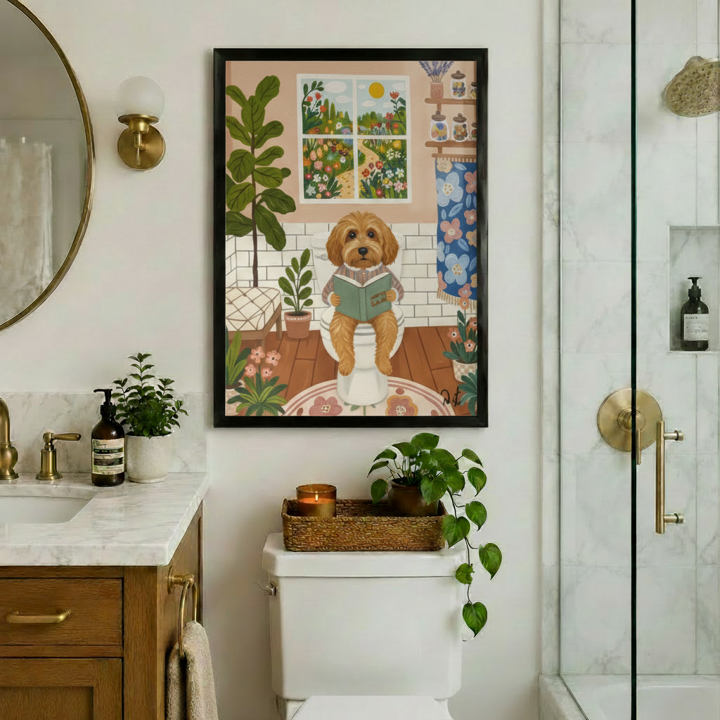Black framed whimsical cottagecore funny goldendoodle bathroom reading canvas art showing a fluffy golden curly doodle dog in a striped pajama top sitting on a white toilet reading a green hardcover book with lush potted plants a fiddle leaf fig a blue floral shower curtain a four-pane sunny garden window and a wooden shelf with glass jars and lavender on a white subway tile background with a floral round rug, hung above a toilet in an elegant bathroom with marble countertops a warm wood vanity gold hardwar