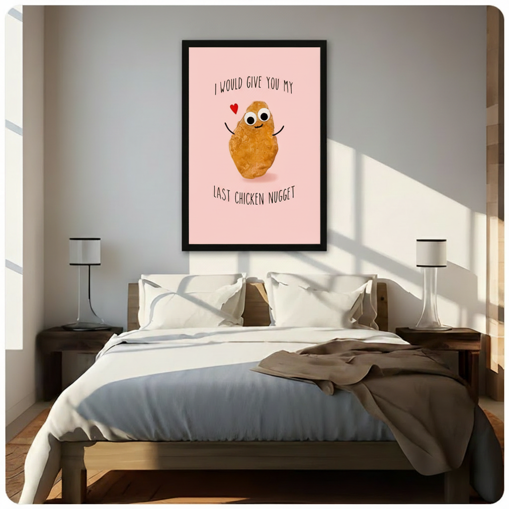 Black framed funny last chicken nugget canvas art with a cheerful cartoon chicken nugget spreading its arms beside a red heart and the hand-lettered quote I would give you my last chicken nugget on a pink background, hung above a wooden bed frame in a sun-drenched minimalist bedroom with crisp white linen bedding and matching cylindrical nightstand lamps
