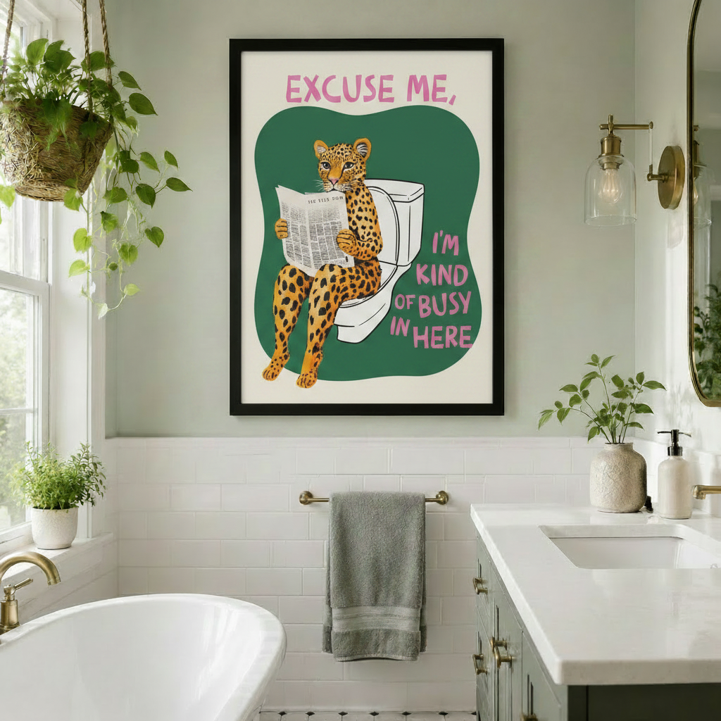 Colorful leopard bathroom humor canvas print in a black frame, displayed on a white subway tile wall in a bright bathroom with a freestanding tub, gold hardware, hanging plants, and a gray towel rail