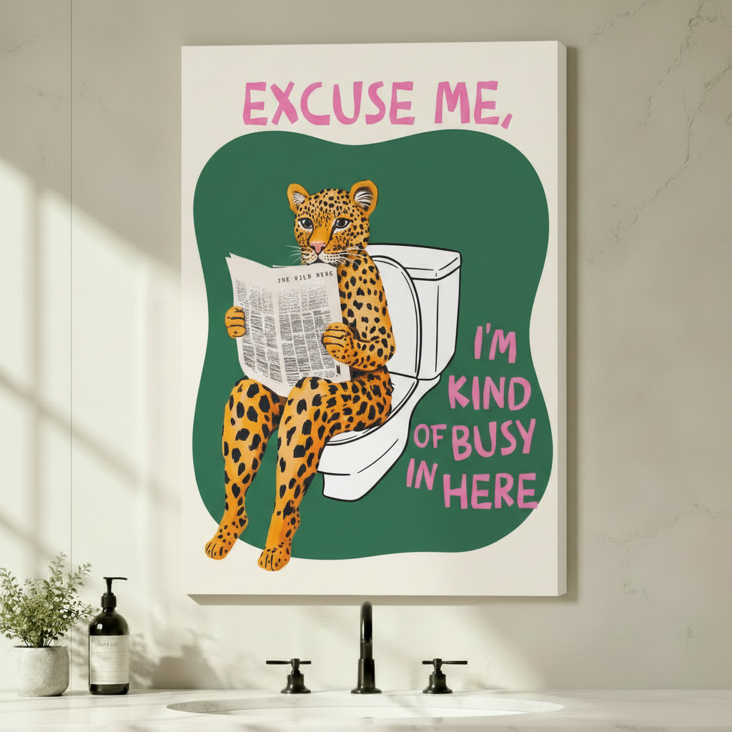 Gallery-wrapped canvas art of a cartoon leopard sitting on a toilet reading a newspaper, hung unframed above a bathroom vanity with black fixtures and potted green plants