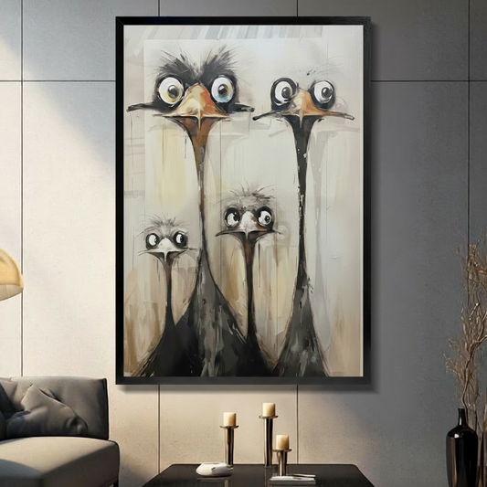 Framed funny ostrich family canvas wall art featuring four wide-eyed long-necked ostriches in expressive oil painting style with beige textured background displayed on a dark grey slate wall in a modern living room