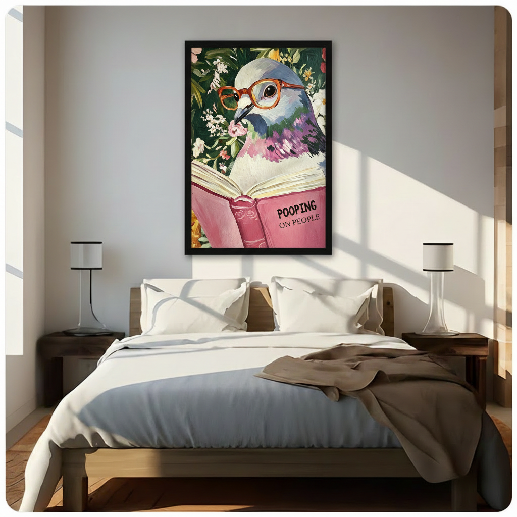 Funny floral pigeon reading book wall art framed print with orange glasses and pink Pooping on People cover hanging above a modern bedroom bed with white linen bedding, dark wood nightstands, and minimalist white table lamps