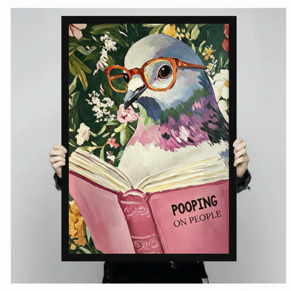 Quirky pigeon in orange glasses holding open pink Pooping on People book funny bird framed wall art print held up for size reference against a light gray neutral background