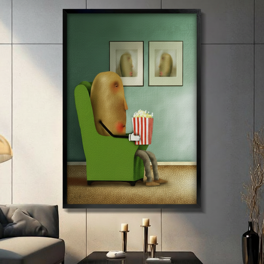 Black-framed surreal potato eating popcorn art print with teal background, gallery-style display in a contemporary living room