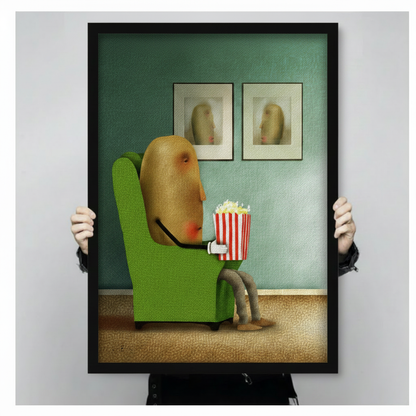 Black framed canvas print of a whimsical potato character holding a popcorn bucket in a green chair, hand-held size display