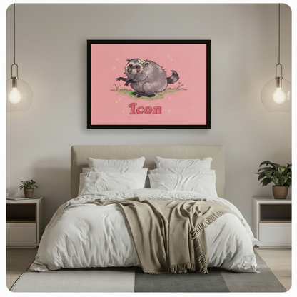 Black framed funny raccoon Icon canvas art with a plump gray raccoon with a daisy crown on green grass and bold pink retro Icon text on a blush pink background, hung above a bed with white linen bedding and glass pendant lights in a modern bedroom